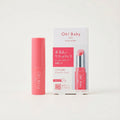 Pink lip balm with packaging on a white background